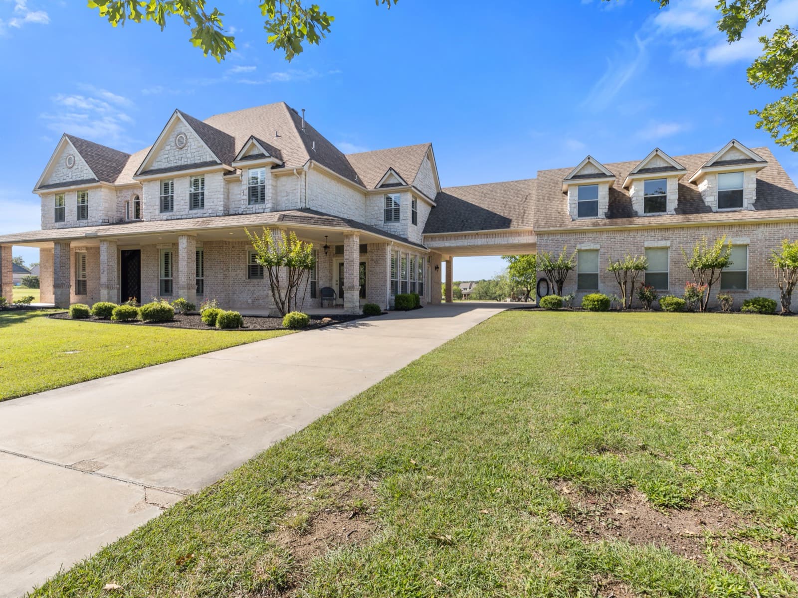 Front elevation of the brick estate at 259 King Ranch Court, Fort Worth